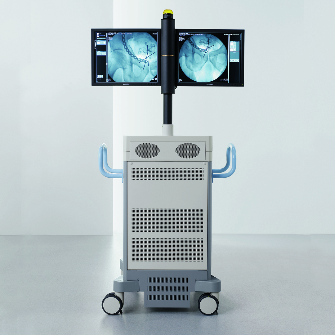 A medical cart with screens attached
